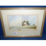 A Kenneth Moore framed and mounted Watercolour of a windmill, signed lower left.