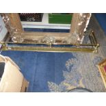 A large brass fire Kerb, 55" wide x 14" deep.