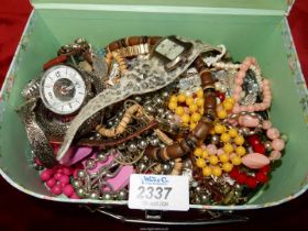 A quantity of costume jewellery in a floral case including bead necklaces, bangles, watches etc.