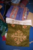 A box of fabric including curtains with tie backs, needlework, etc.