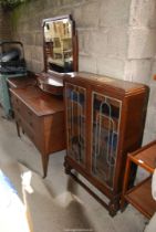 A display cabinet plus a large dressing table with mirror and an oak chest of drawers.