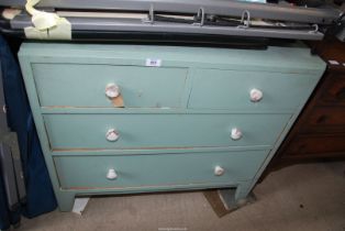 A green painted chest of two short over two long drawers.