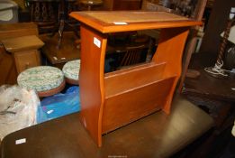 A Satinwood finish Magazine rack Table with inset leather top.
