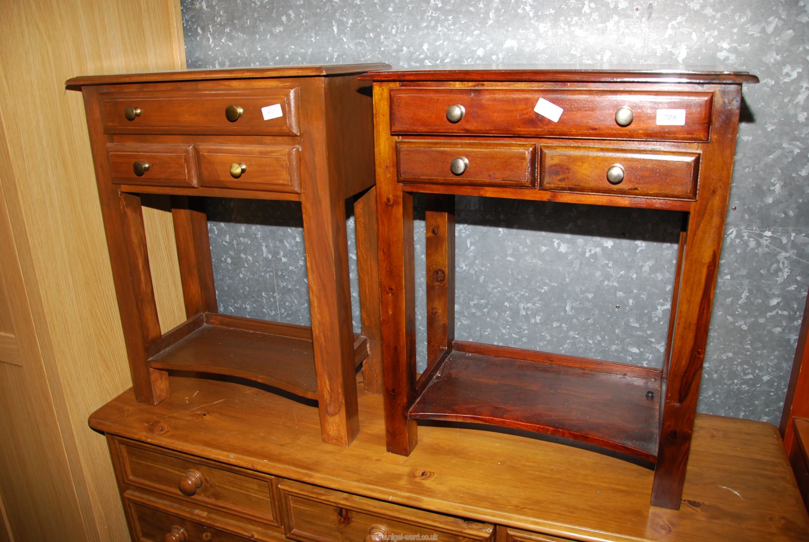 Two Mahogany hall tables with three drawers.