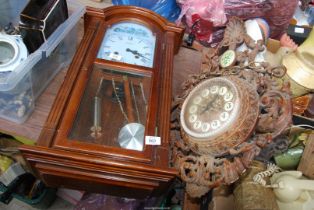 A Highlands wall clock plus another.