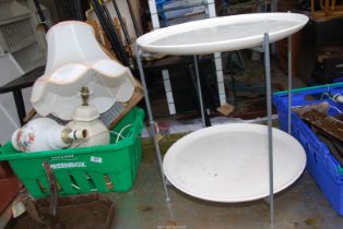Two table lamps and a wash board and a plastic two tier table with metal legs.