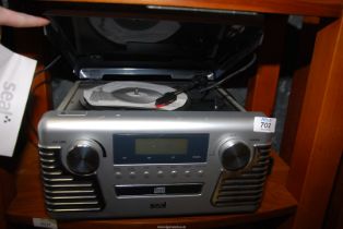A Seal Turntable AM/FM Radio with CD player.
