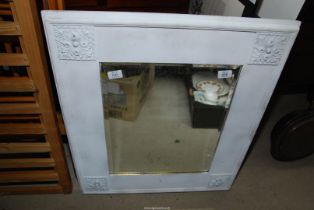 A large mirror with wooden frame, 25" wide x 29 1/2".