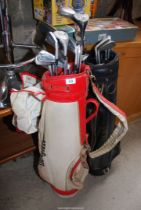 A 'Wilson' golf bag and a 'Howson' golf bag with clubs.