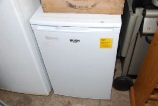 A Bush under-counter fridge, (new plug required).
