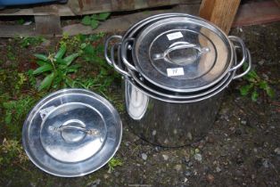 Three Stainless steel containers.