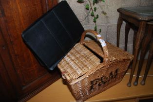 A Fortnum & Mason picnic basket and a faux leather stationery case.