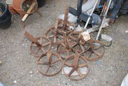 Eight cast iron 12" fowl house wheels.