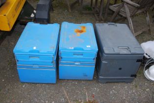 Three storage containers for fishing.