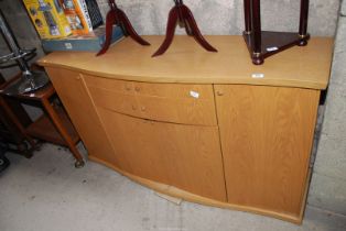 A modern bow fronted sideboard, 61 1/2" x 34" x 18" deep.