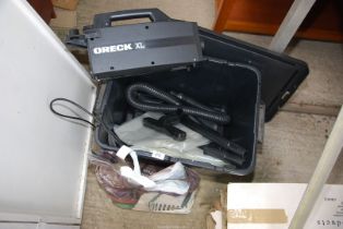 Oreck XL hoover and attachments plus a quantity of bags.
