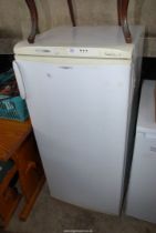 A Freshline upright fridge with top freezer box, 4' high.