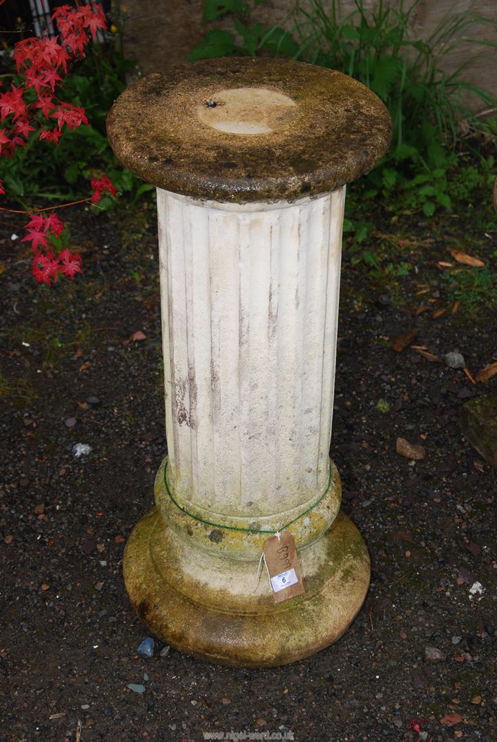 A Concrete pillar, 31" high.