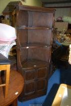 A dark Oak Corner Cupboard with open shelves over, 28'' wide x 72 1/2'' high.