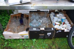 Three boxes of china, glass and mugs.