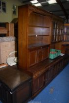 An Oak lounge unit with shelves and cupboard, loose top 3' wide x 17 1/2" deep x 76" high.