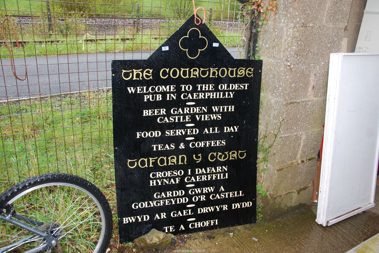 A large metal 'Pub' sign.