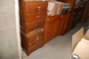 A pine cupboard with top drawer and two bedside tables.