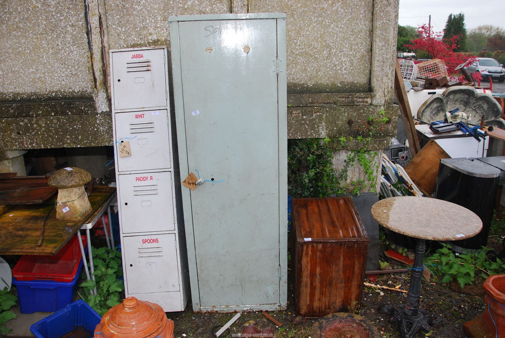 A metal cabinet with three shelves, 2' wide x 18" deep x 71" high, a four drawer locker,