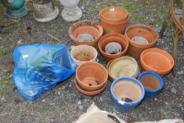 A quantity of terracotta plant pots, hanging basket & artificial grass.