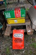 A wooden piano trolley/dolly plus three old 'gallon' cans.