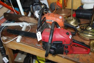 A Husqvarna chainsaw (no pull cord or safety brake - for spares and repairs).