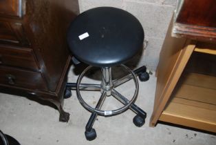 A swivel stool on castors.