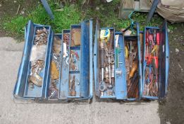 Two cantilever tool boxes, containing screws, spanners, sockets, screwdrivers, etc.