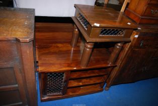 An eastern hardwood TV cabinet and a small eastern occasional table.