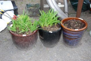 Three glazed planters.