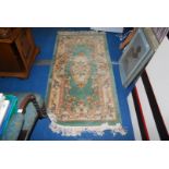 A Chinese green pattern rug, 30" x 61".