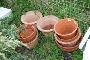 A quantity of clay pots, various sizes.