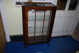 A walnut finished, glass fronted display cabinet, 27 1/2" wide x 12" deep x 43" high.