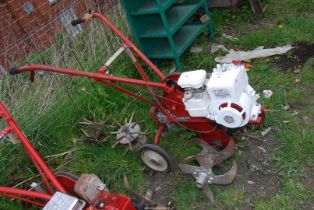 A 'Wolseley Merrytiller' Rotavator with Briggs & Stratton 4 stroke engine with spare tiller feet.