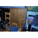 A triple wardrobe with two lower drawers, 59" wide x 21" deep x 80" high.