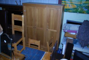 A triple wardrobe with two lower drawers, 59" wide x 21" deep x 80" high.