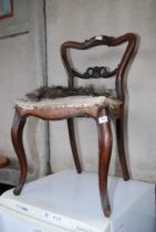 An elegant old chair for restoration, with horse hair.