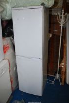 A Hotpoint fridge freezer, 69" high.