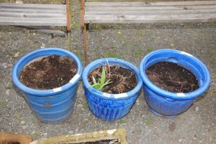 Three blue glazed planters.