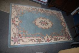 A blue Chinese style rug, 47" x 72''.