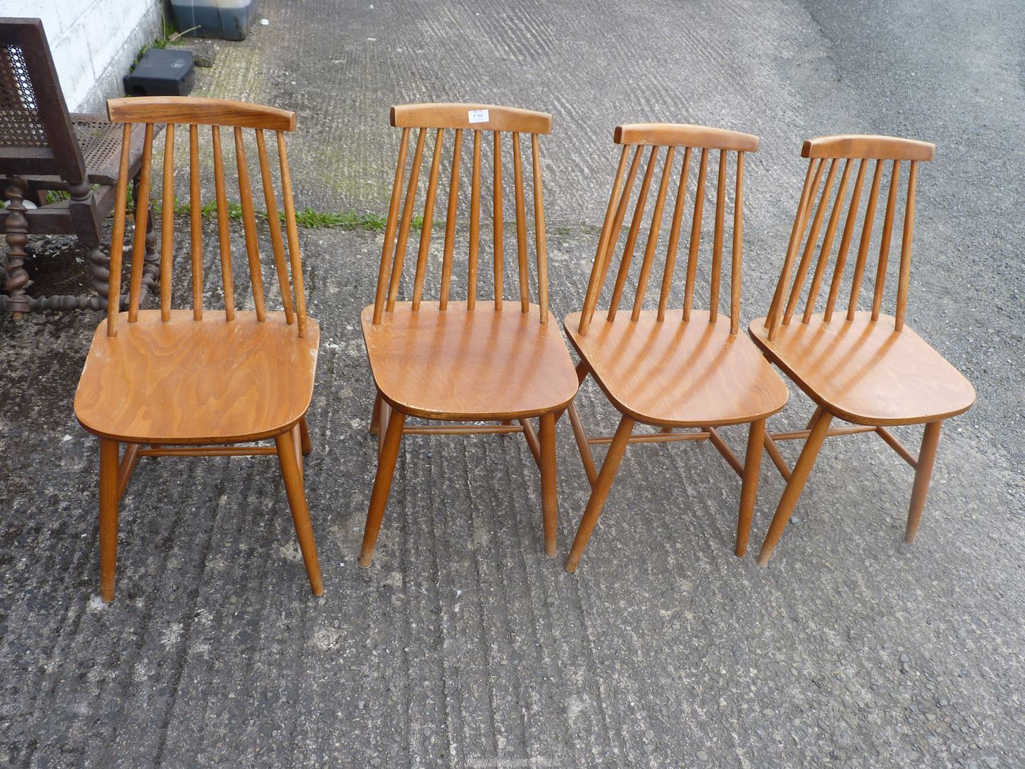 Four kitchen stick back chairs.