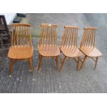 Four kitchen stick back chairs.