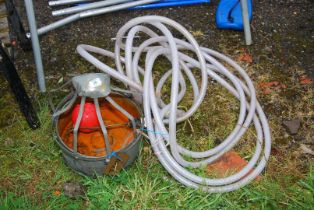 A chicken water drinker with ball cock and pipe work.