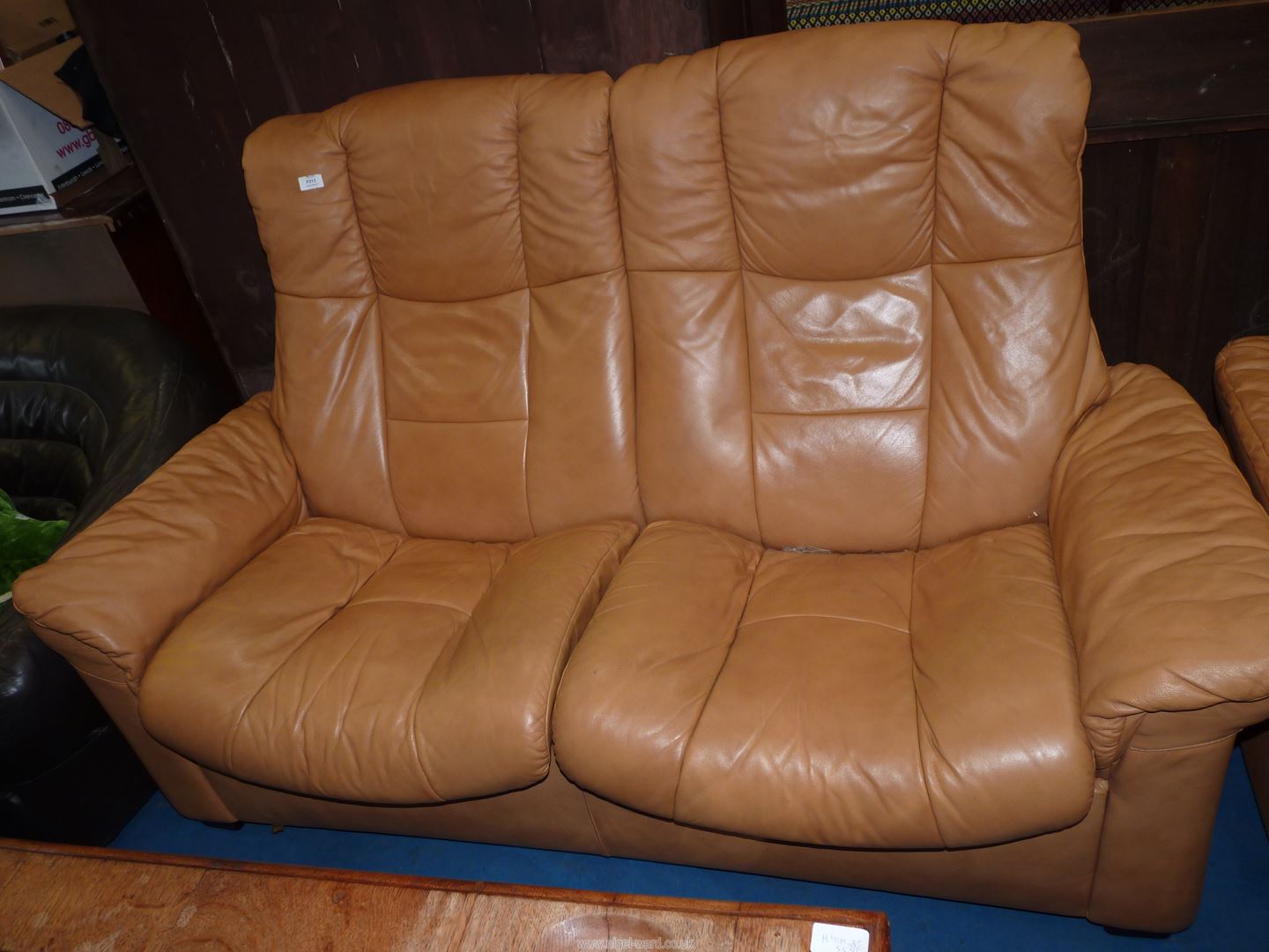 A Ekornes Stressless type tan soft hide upholstered Lounge Suite comprising a two seater settee and