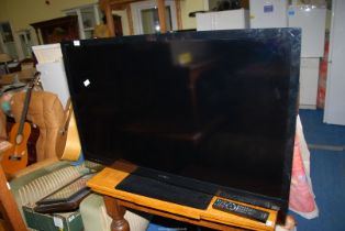 A Sony flat screen TV model, ''KDL-46 ex 73'' with remote.